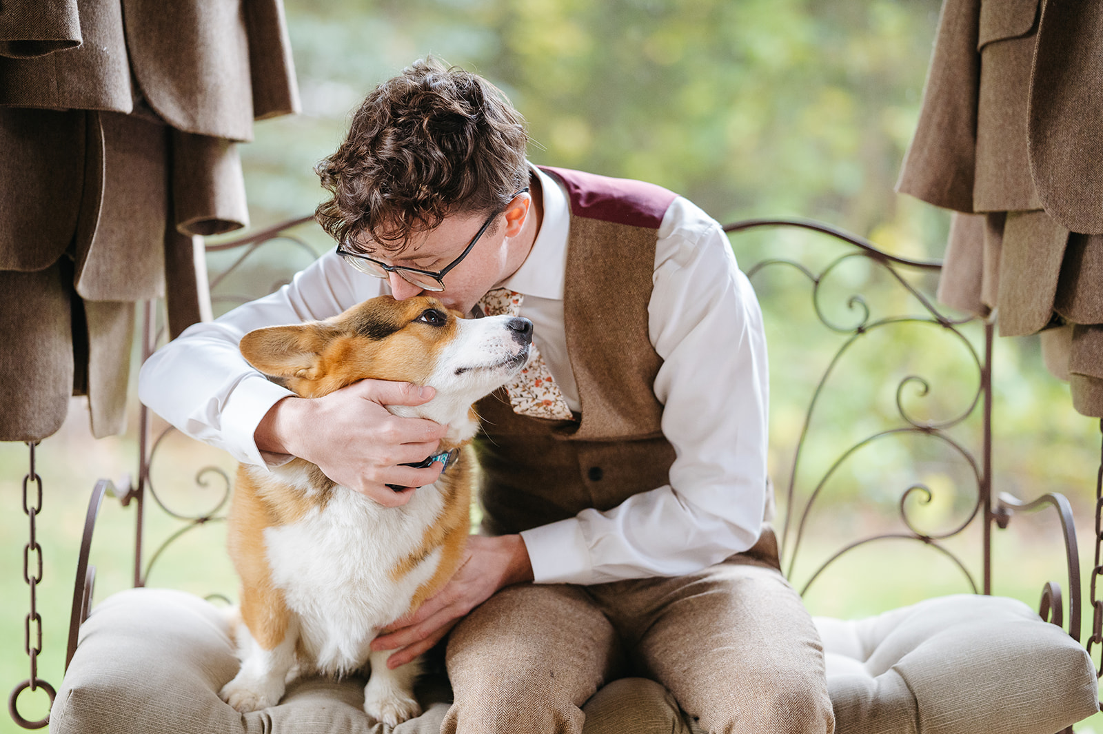 Groom spending time with his dog before the wedding